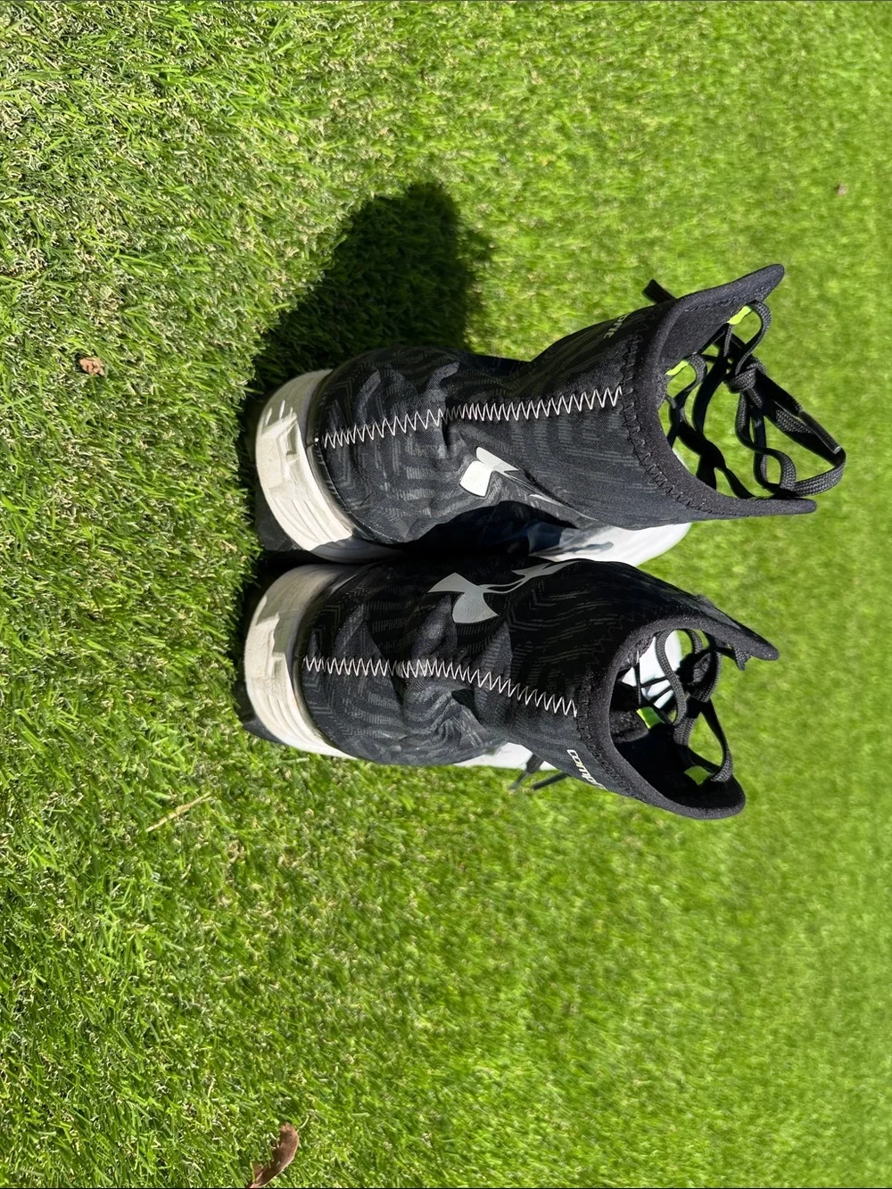 Under Armour Men’s White and Black High-Top Athletic Cleats
